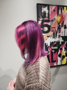 Pink and purple striped hair at Artisan Hair Salon in Cary NC